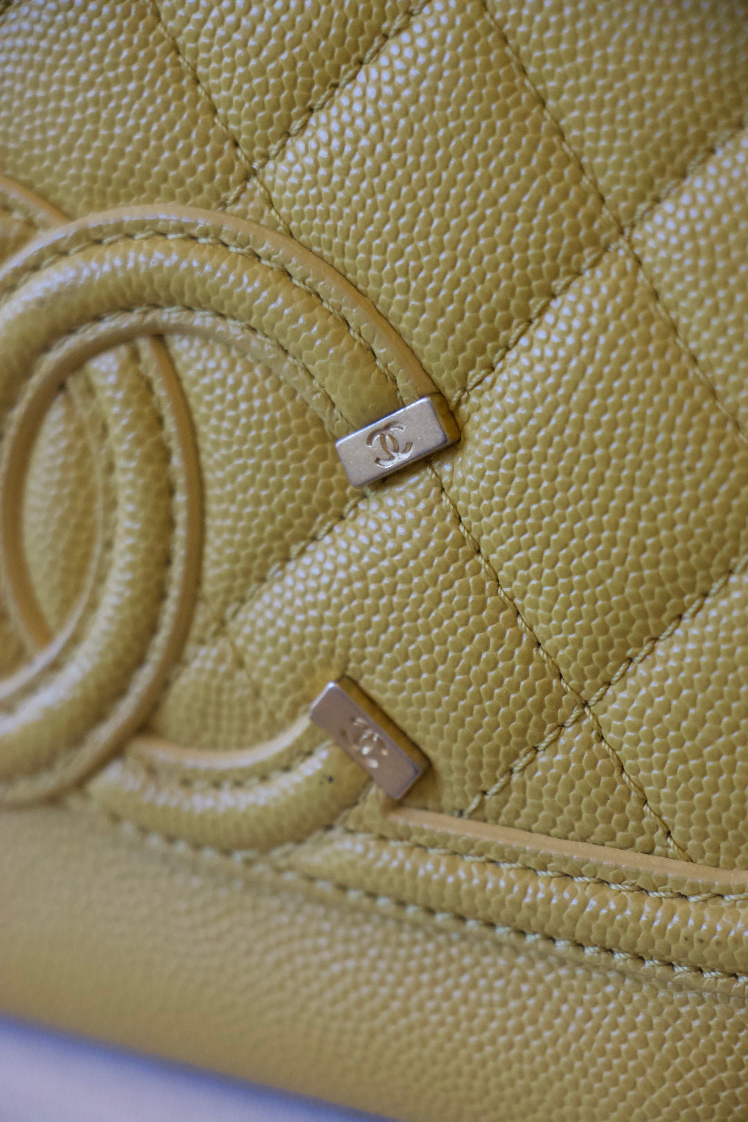Chanel Filigree Wallet on Chain Yellow logo