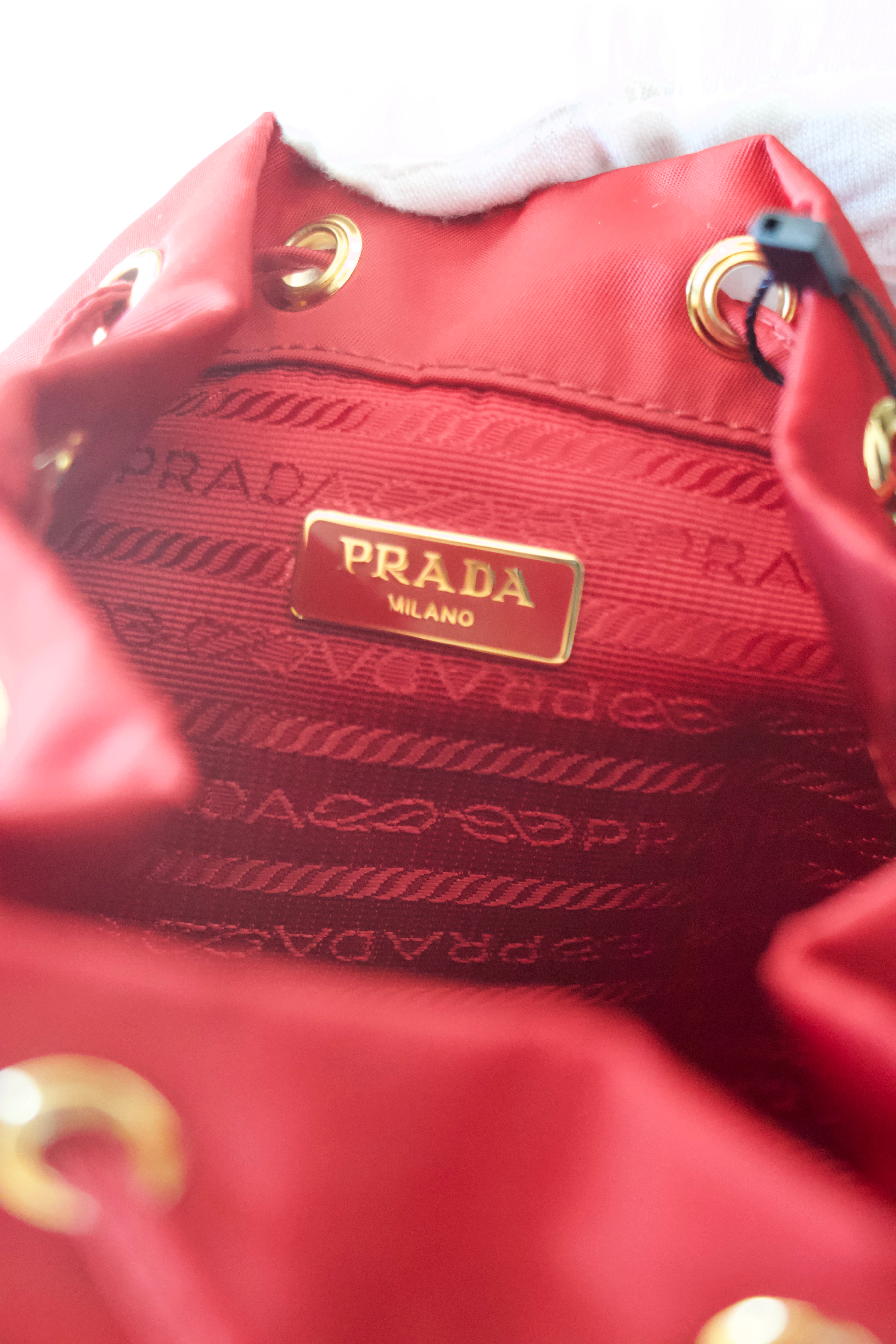 Prada Enameled Metal Triangle Bucket Bag